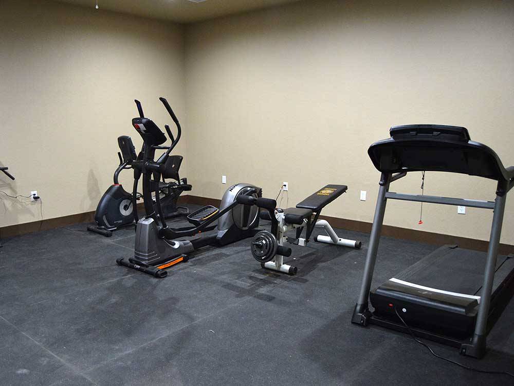 Exercise equipment in the gym at HIDDEN CREEK RV RESORT