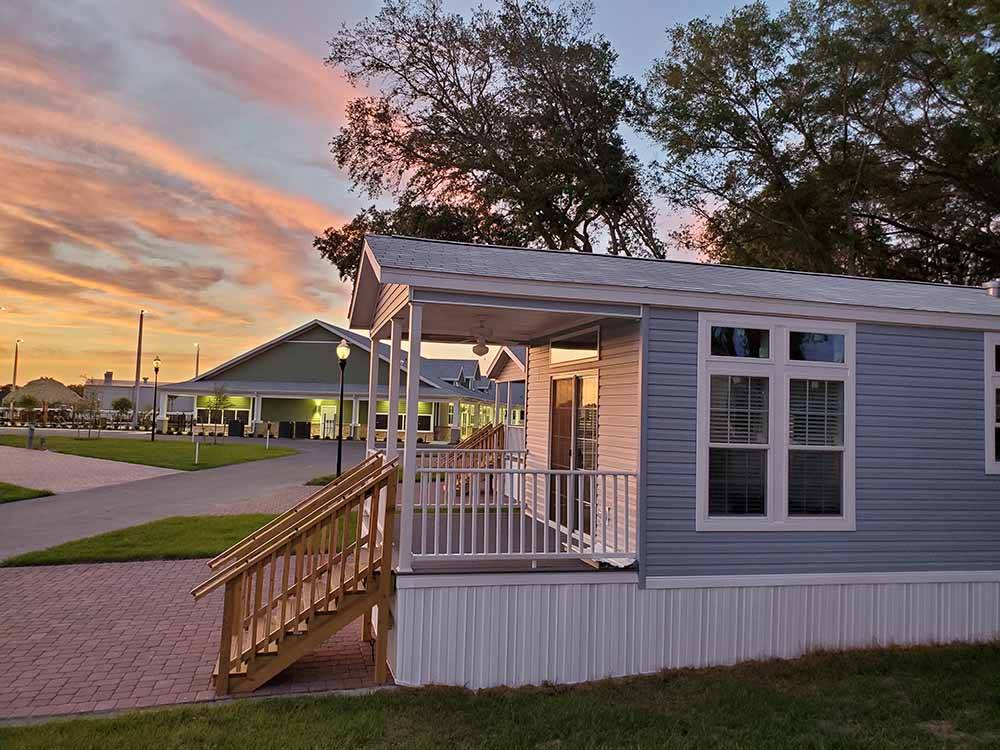 A row of rental manufactured homes at SUNKISSED VILLAGE RV RESORT