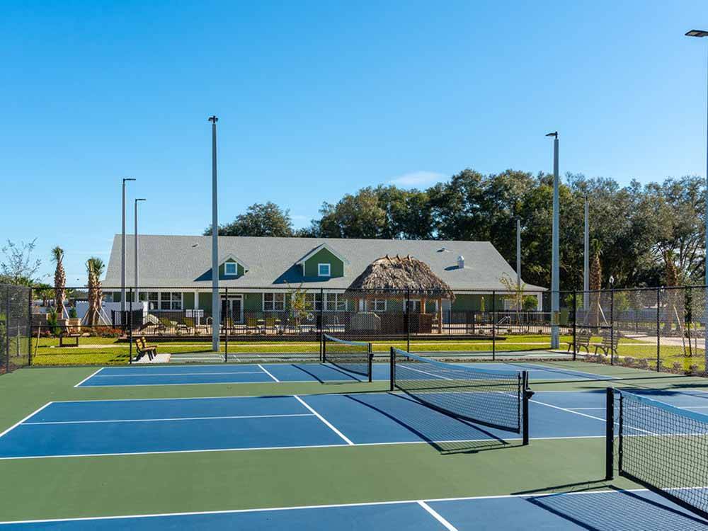 The blue pickleball courts at SUNKISSED VILLAGE RV RESORT