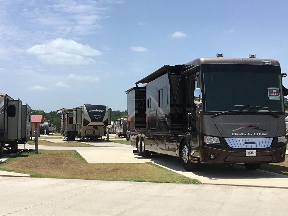 A Class A motorhome in a RV site at EAST FORK RV RESORT
