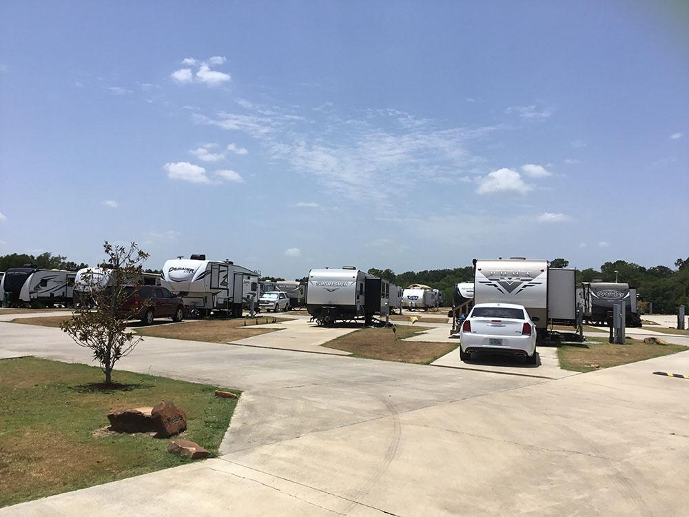 A row of trailers parked in RV sites at EAST FORK RV RESORT