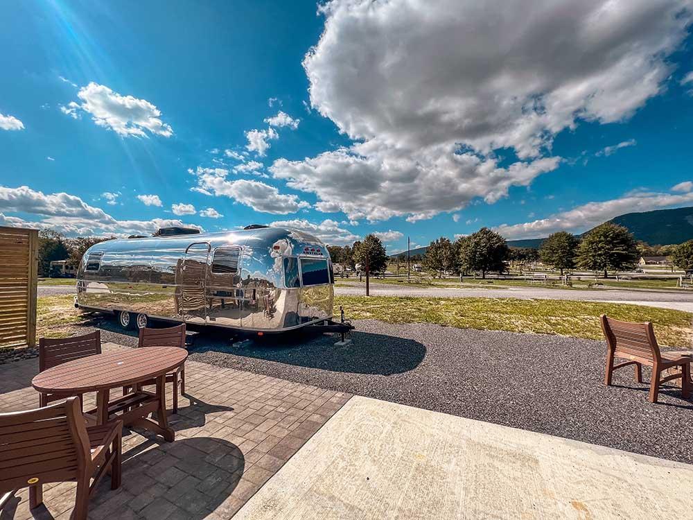 A shiny Airstream parked on-site at LURAY RV RESORT & CAMPGROUND ON SHENANDOAH RIVER