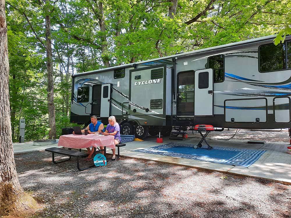 Motorhome and campers enjoying a picnic at GATEWAY TO THE SMOKIES RV PARK & CAMPGROUND
