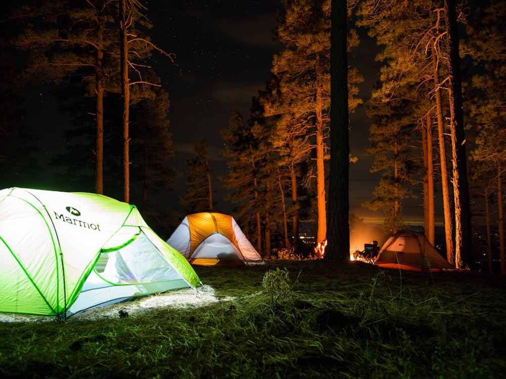 A group of tents at night at IRON MOUNTAIN RESORT