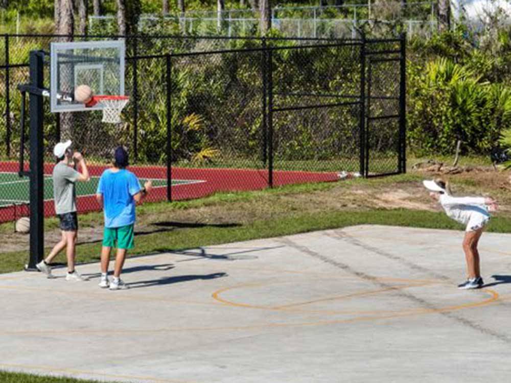 People playing basketball at RESORT AT CANOPY OAKS