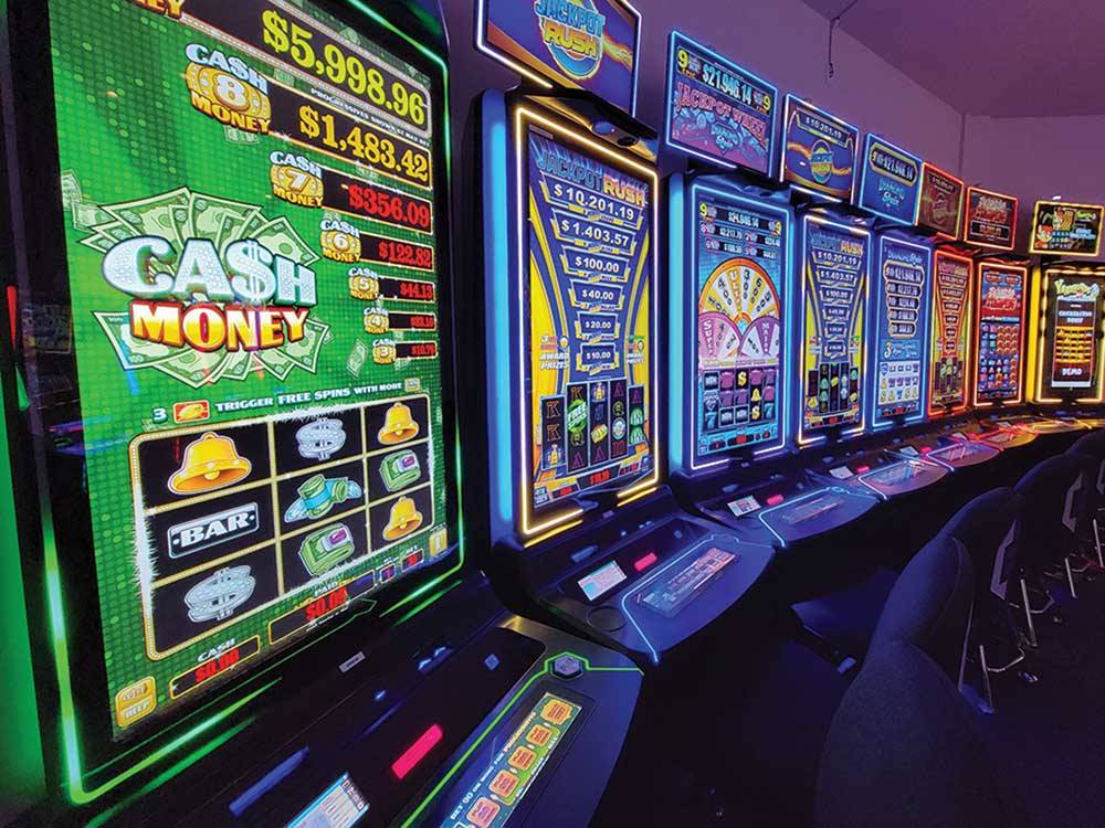 Gambling machines shining in a row at BIG ARM RESORT & CASINO