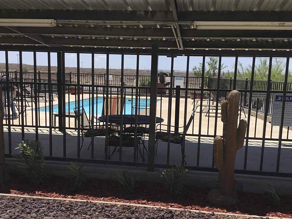 Looking at the pool thru the fence at HILLTOP RV PARK