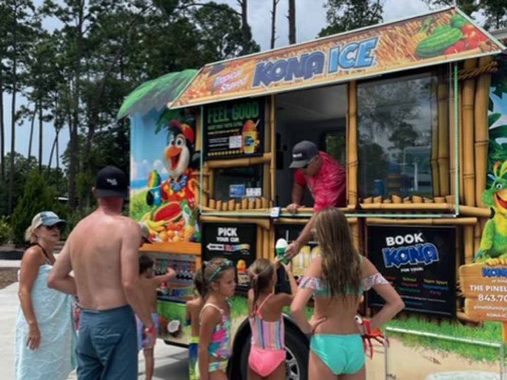 A group of people getting Kona Ice at HILTON HEAD NATIONAL RV RESORT