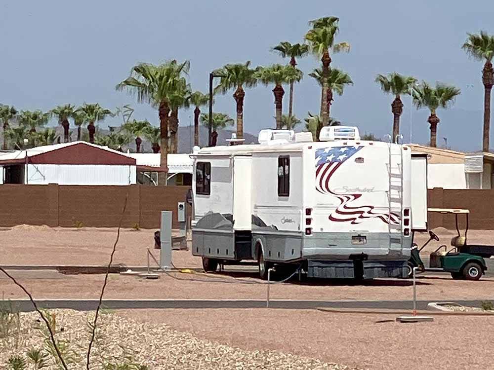 An RV parked in one of the RV sites at CAMPGROUND USA RV RESORT