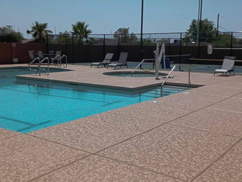 The swimming pool area at CAMPGROUND USA RV RESORT