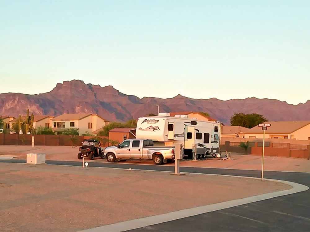 A fifth wheel trailer in an RV site at CAMPGROUND USA RV RESORT