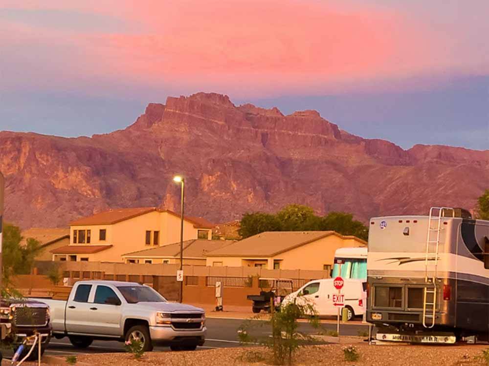 A truck and motorhome at CAMPGROUND USA RV RESORT