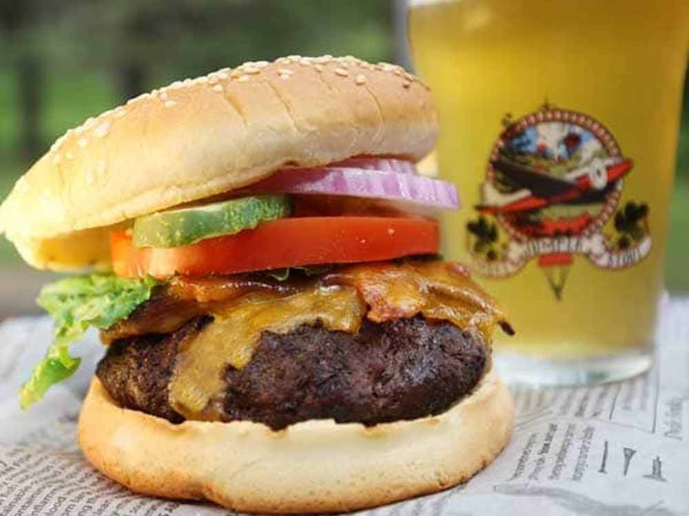 Cheeseburger and a beer at FIREHOUSE CAMPGROUND