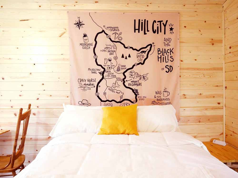 Cabin decor with a large map of Hill City and the Black Hills at FIREHOUSE CAMPGROUND