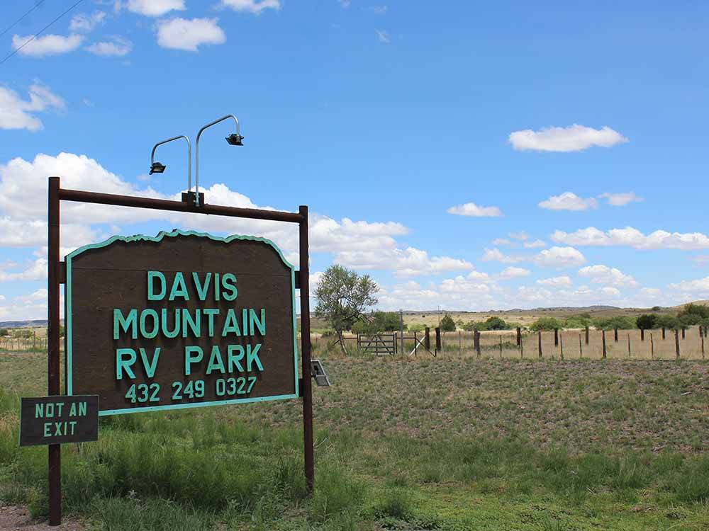 The brown and teal entrance sign at DAVIS MOUNTAIN RV PARK