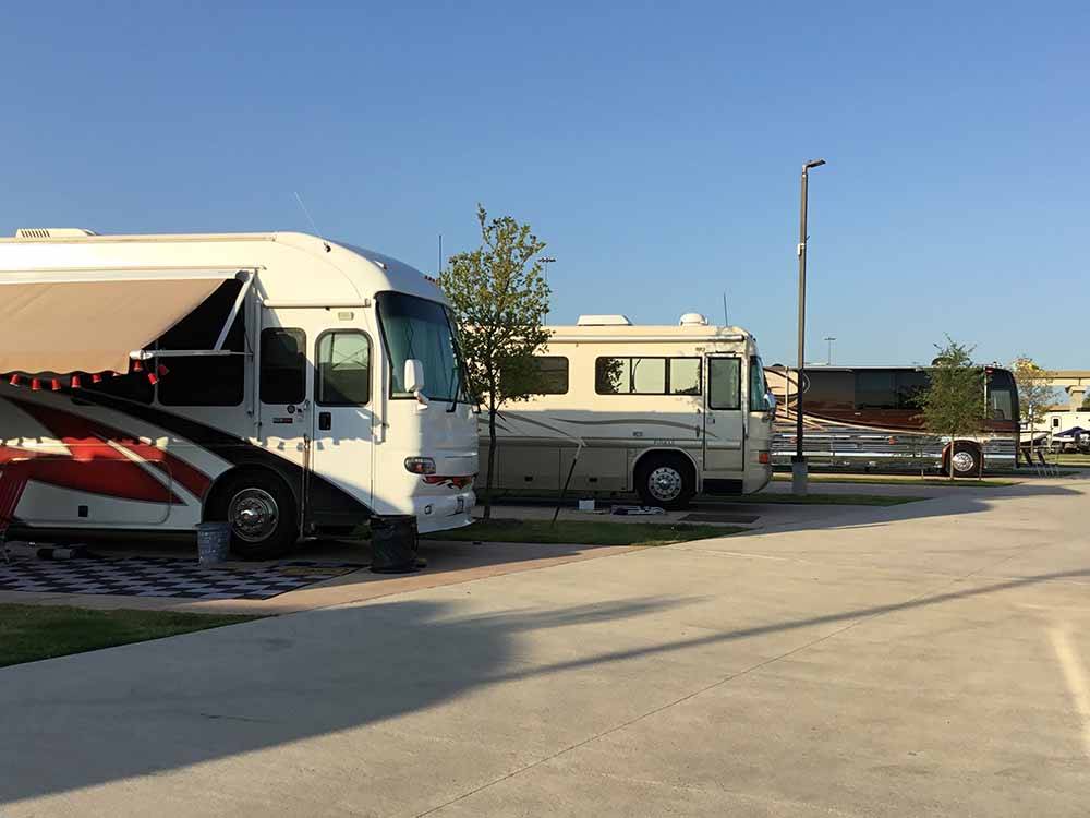 A row of motorhomes backed in at LAKESHORE RV RESORT