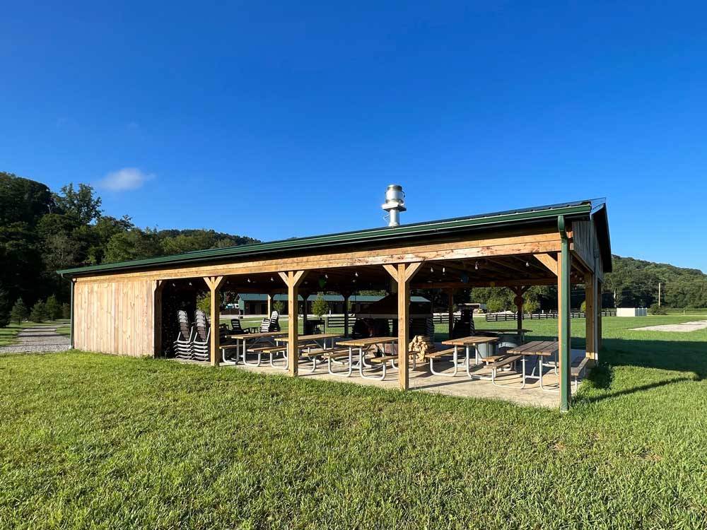 Picnic area with canopy covering it at PINE CREEK CABINS AND CAMPGROUND