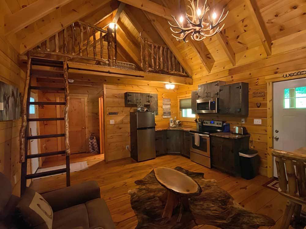 Camping cabin with loft and vaunted ceiling at PINE CREEK CABINS AND CAMPGROUND