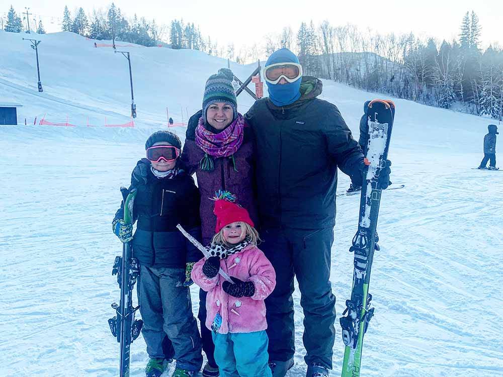 A family in snow & skiing gear at MONT DU LAC RESORT