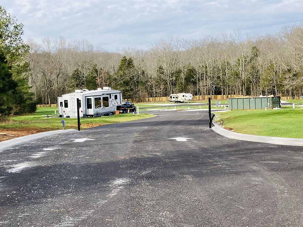 A paved road to the RV sites at WHISPERING FALLS RV PARK AND STORE