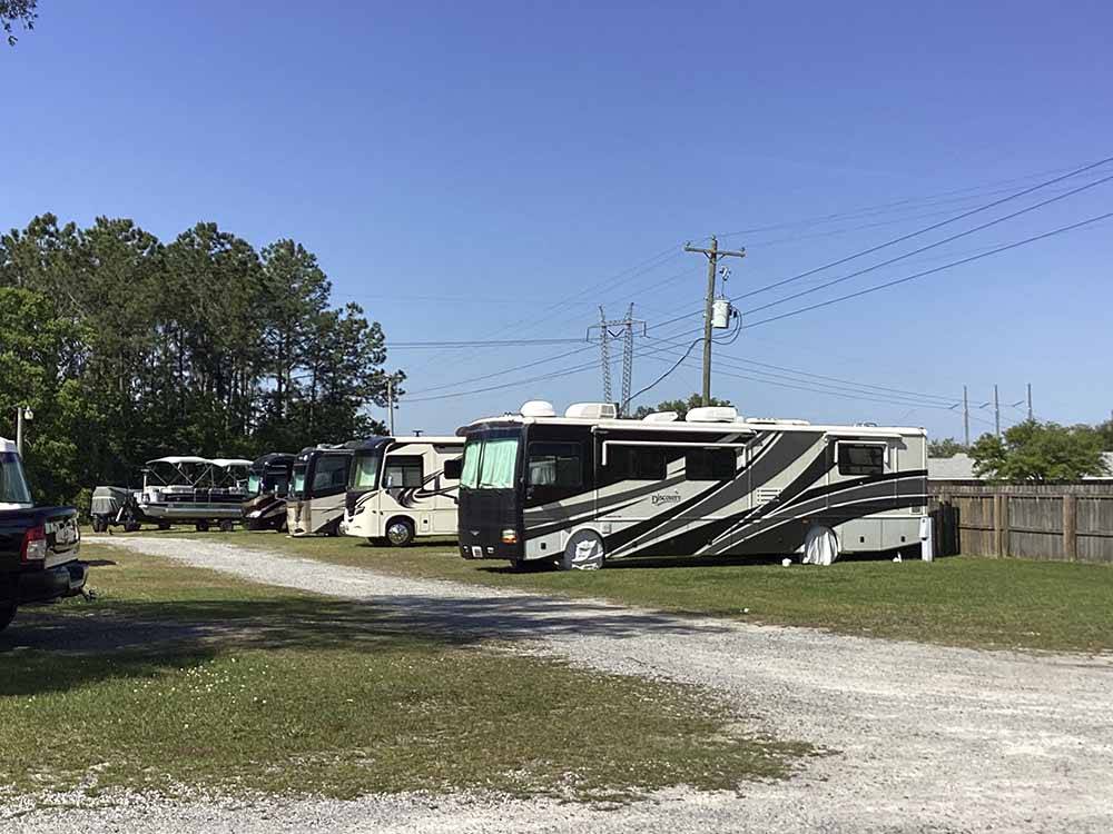 Motorhomes parked in grass at CAMPGROUNDS OF THE SOUTH