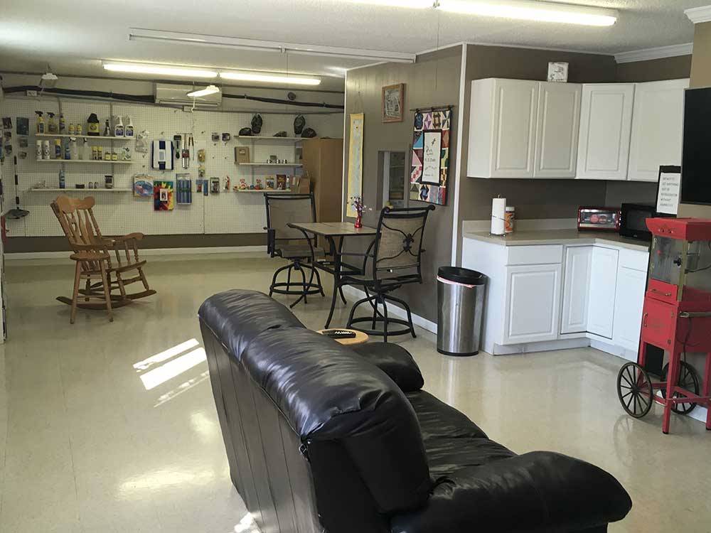 Interior of club house with kitchen at DUCK CREEK RV PARK