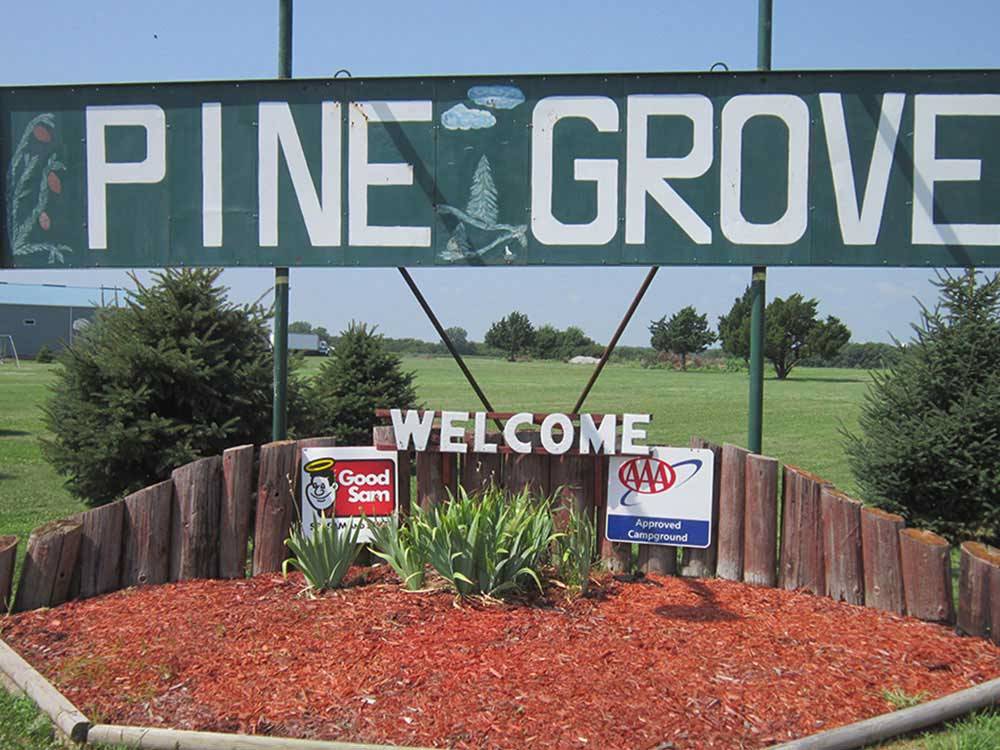 Welcome sign at entrance at PINE GROVE RV PARK