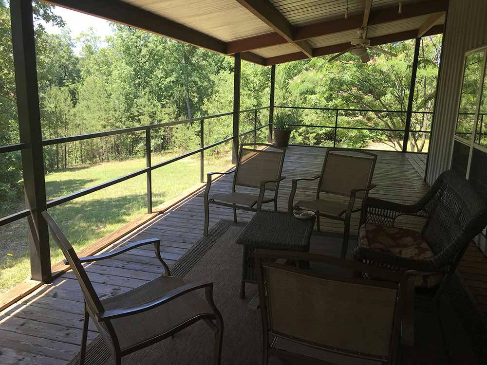 Outdoor porch seating at CLOUD NINE RV PARK