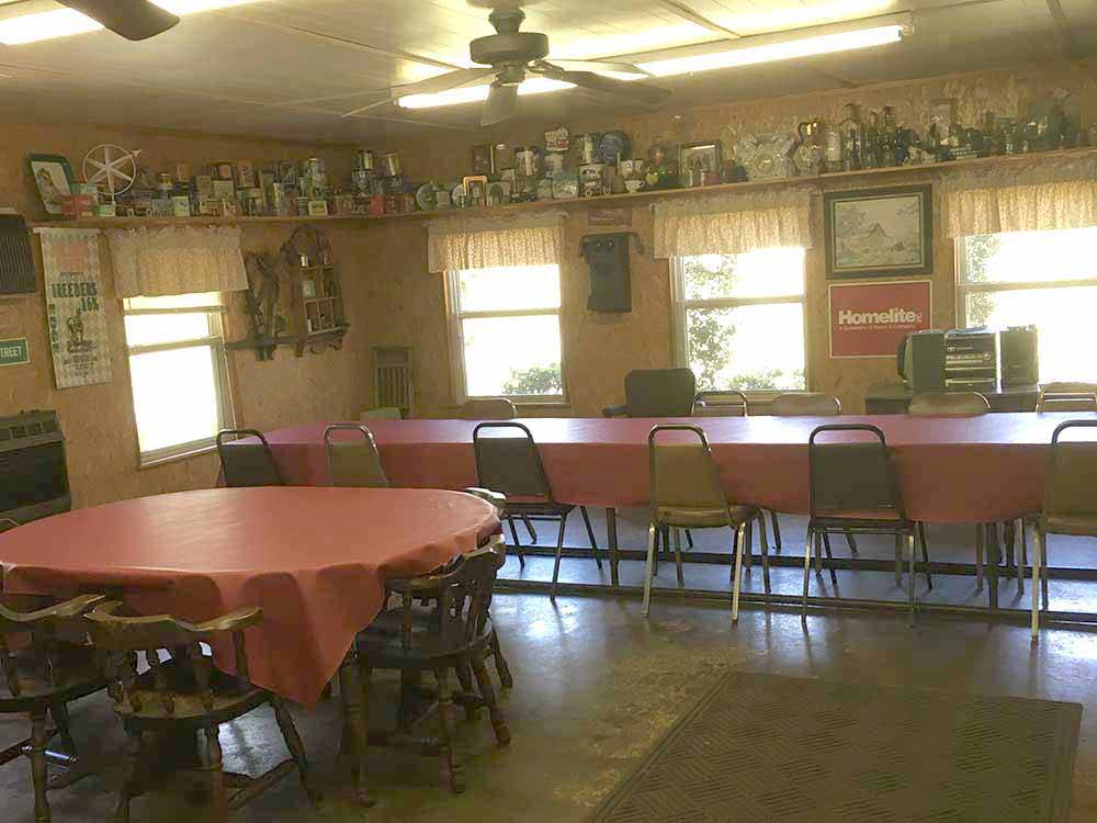 Dining area with large red tables at J & J RV PARK