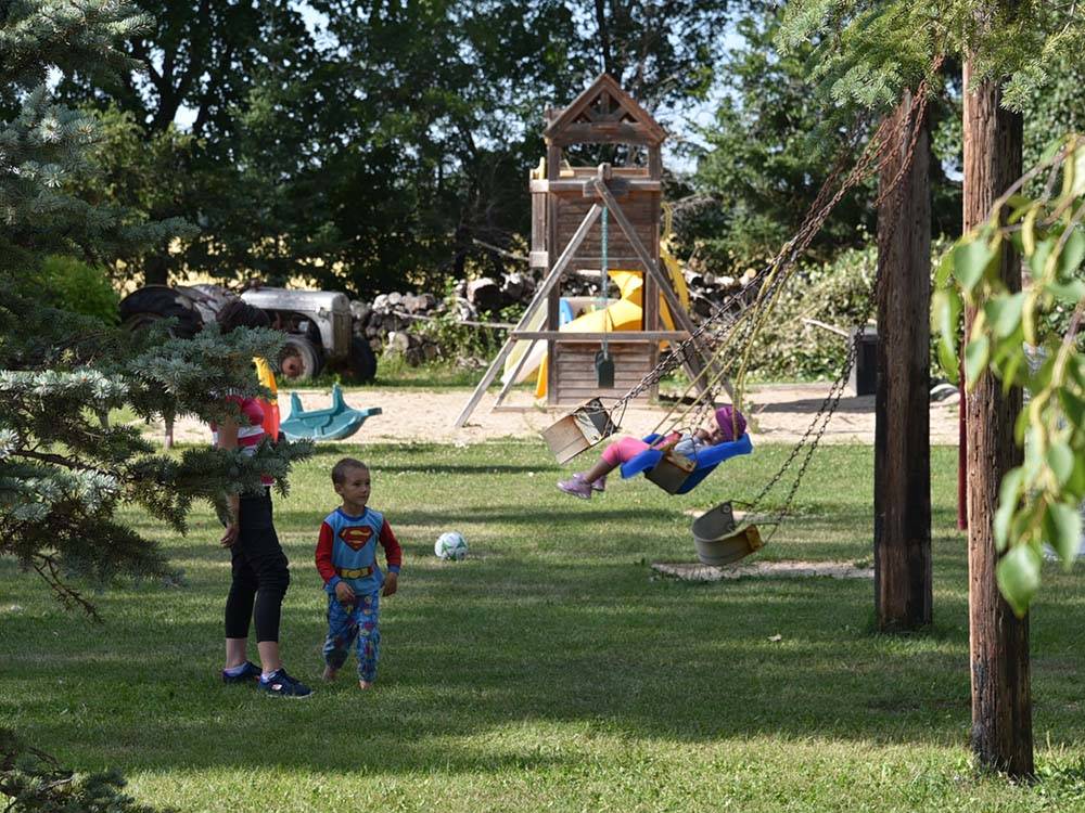 Kids playing at playground at ARROWHEAD RV PARK