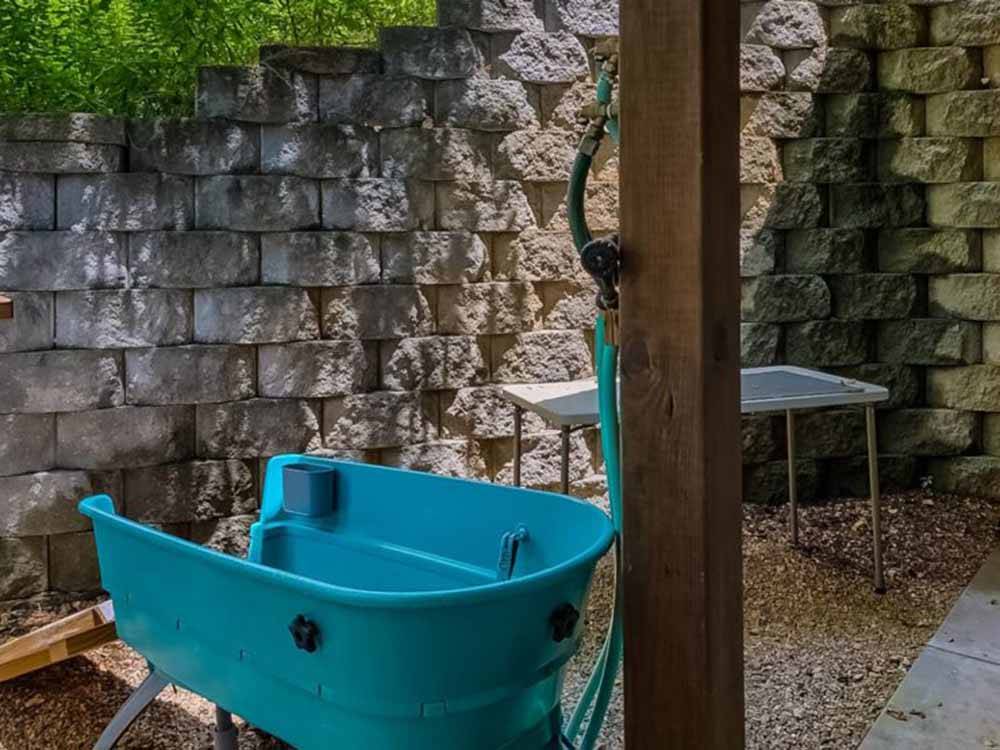 A pet washing tub with hose at THE GREAT OUTDOORS RV RESORT