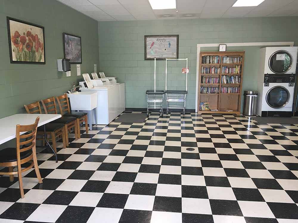 A clean laundry room with a checkered board floor  at THE GREAT OUTDOORS RV RESORT