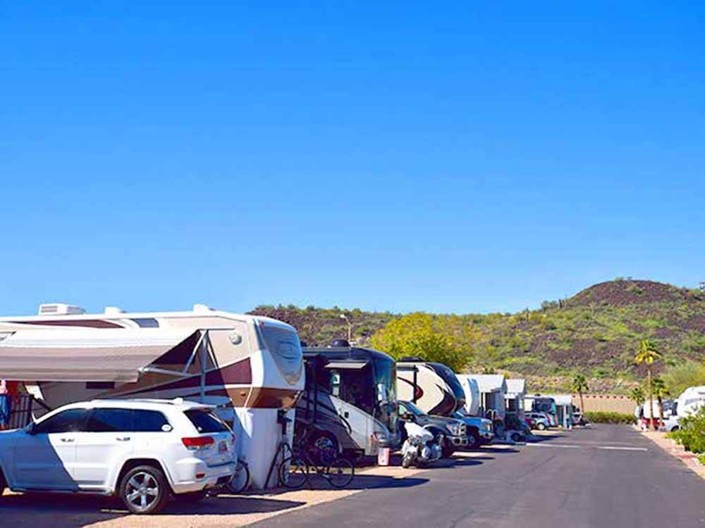 RV campground with hill in the background at PHOENIX METRO RV PARK