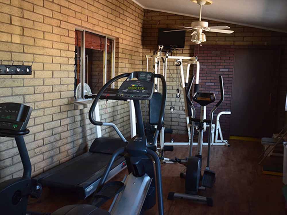 Exercise room with treadmill and elliptical machines at PHOENIX METRO RV PARK