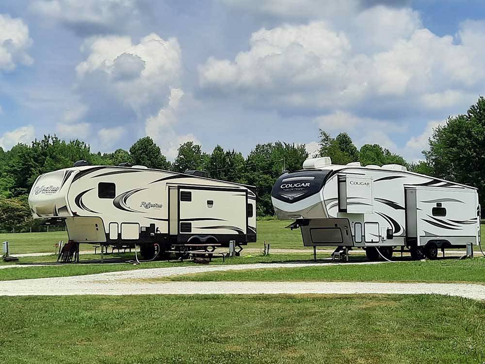 A row of gravel RV sites at SINGING HILLS RV PARK