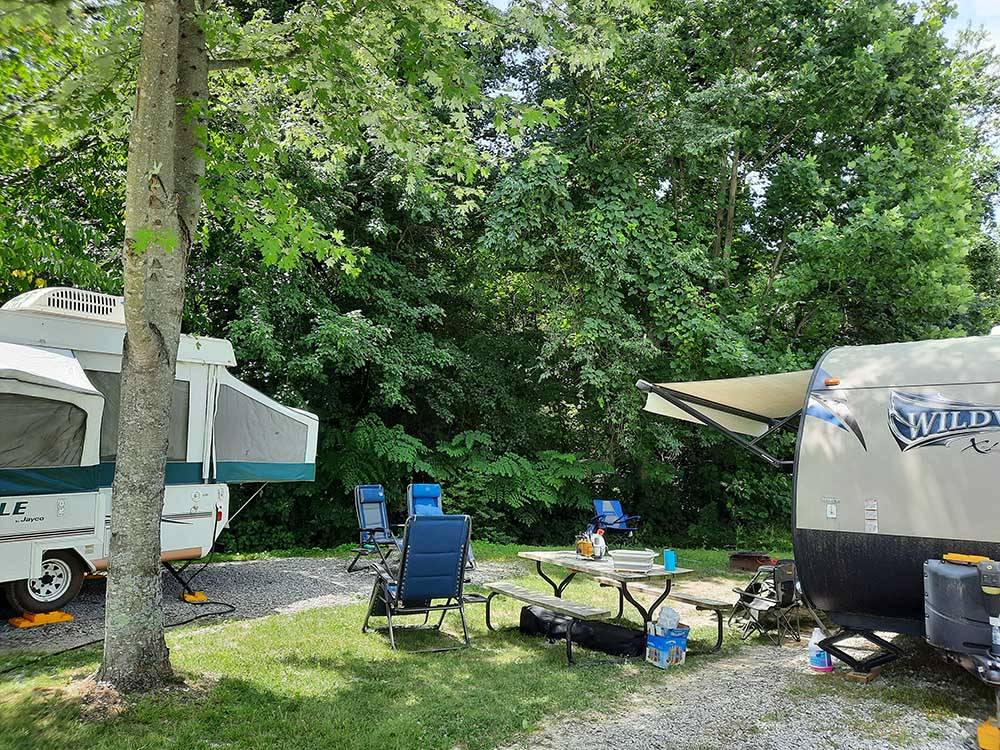 A group of gravel RV sites at SINGING HILLS RV PARK