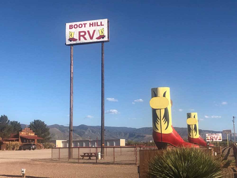 Entrance sign and giant boots at BOOT HILL RV RESORT