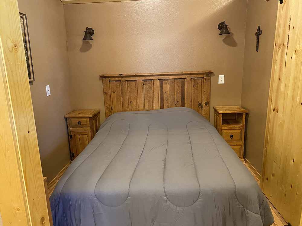 The bedroom in the rental cabin at BOOT HILL RV RESORT