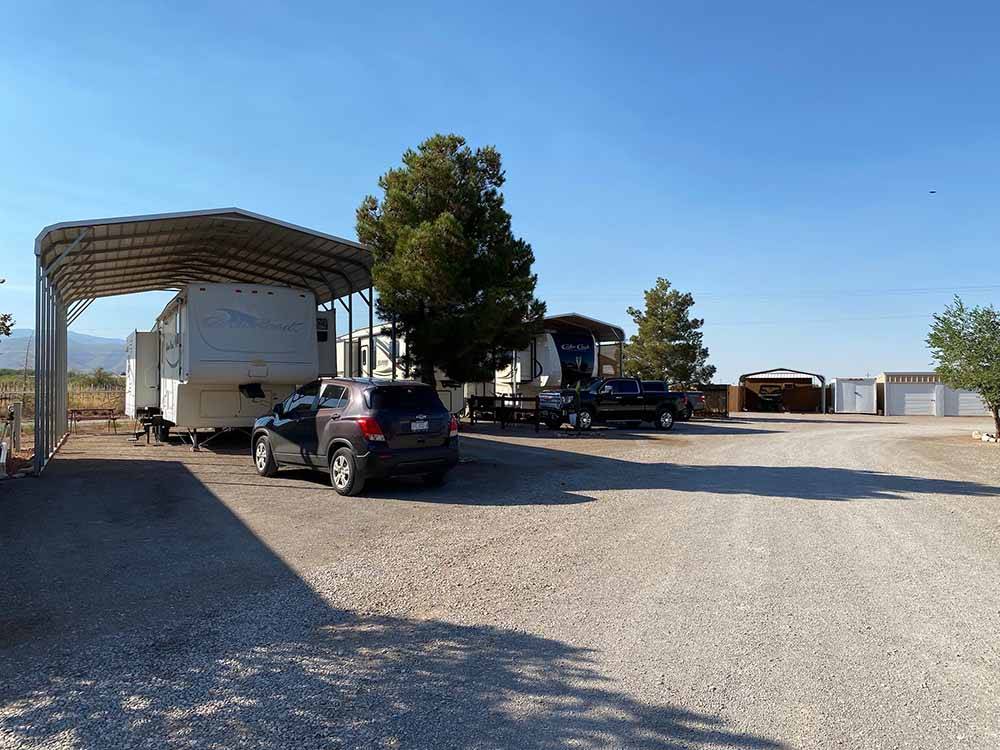 A row of covered RV sites at BOOT HILL RV RESORT