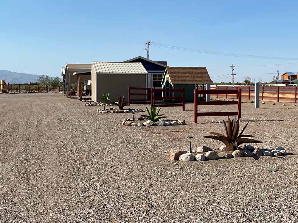A row of gravel RV sites at BOOT HILL RV RESORT
