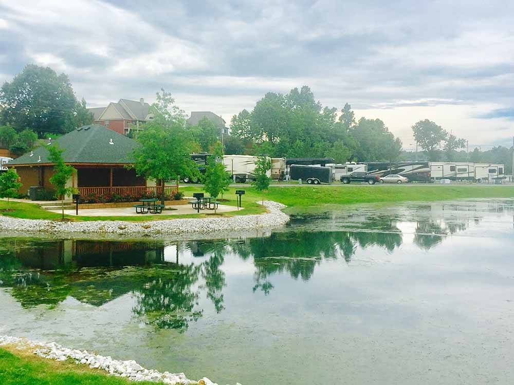 RVs parked near water's edge at THE CREEKS GOLF & RV RESORT
