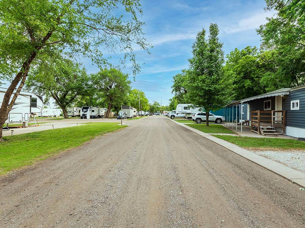 Long road flanked by campsites at K & R RV PARK