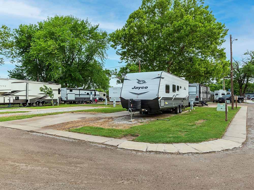 Jayco travel trailer in campsite with concrete patio at K & R RV PARK