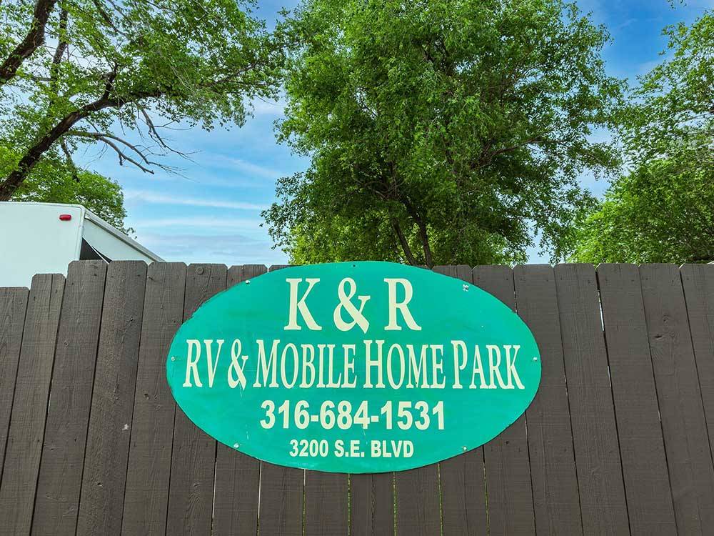 Green oval K&R RV and Mobile Home Park sign at K & R RV PARK