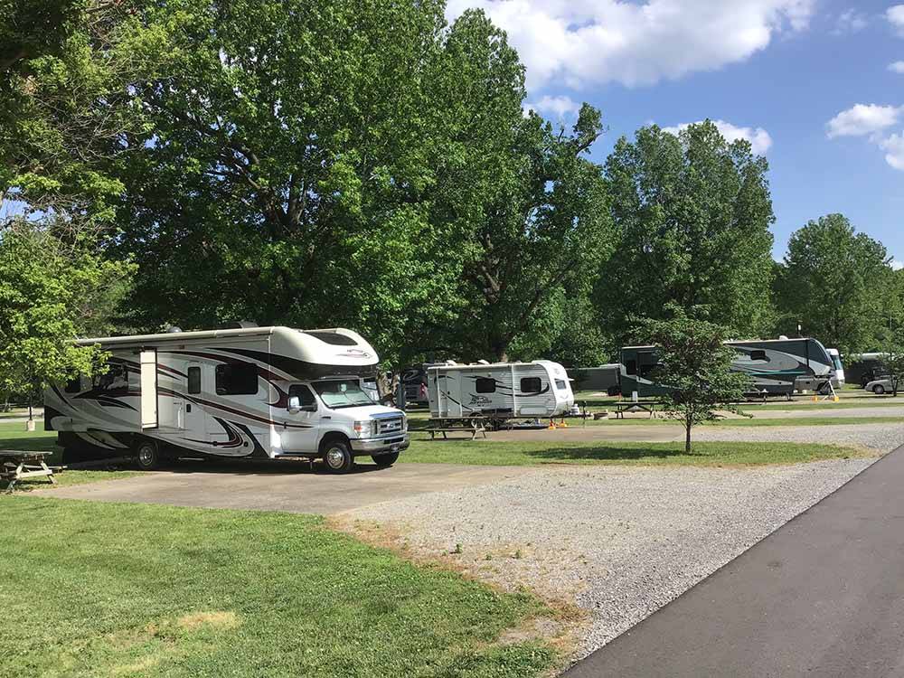 A row of concrete pad RV sites at THE LANDING POINT RV PARK