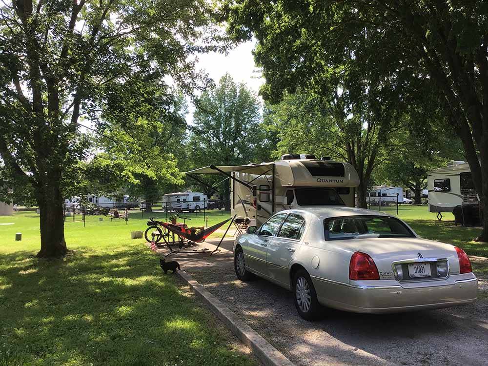A car parked in a RV site at THE LANDING POINT RV PARK