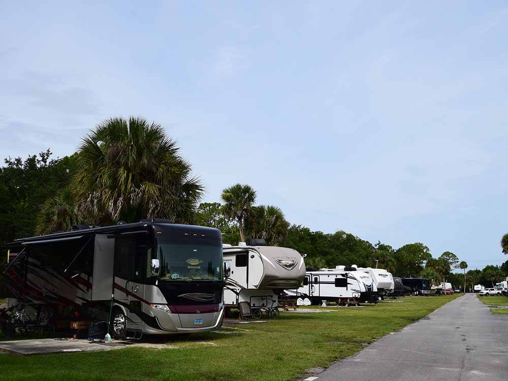 A view down the road of parked motorhomes at JOY RV RESORT