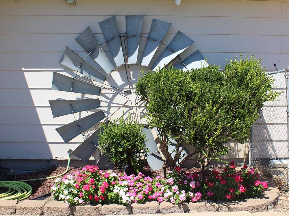 Windmill decoration with flowers at NORTH STAR RV PARK