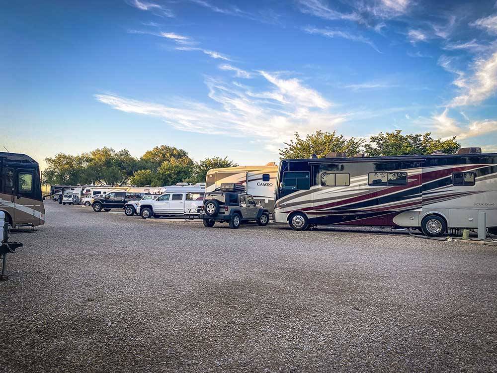 A row of motorhomes and trailers parked in sites at TRAILER VILLAGE RV PARK