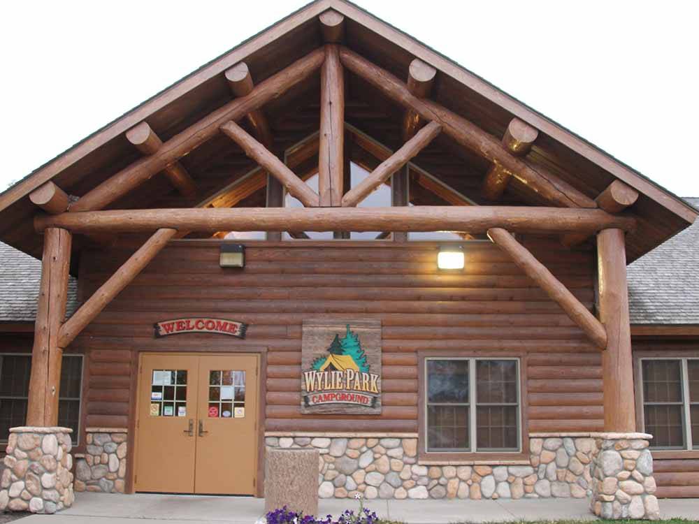 The registration building with log facade at WYLIE PARK CAMPGROUND & STORYBOOK LAND
